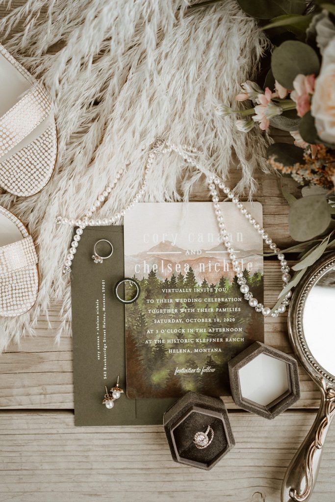 Beautiful wedding invitation, jewlery, bouquet and bride shoes for Montana Wedding. Photographed by Montana wedding photographer Ashley J Photography.